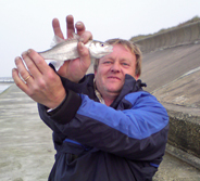Keith showing small Sea Bass to throw back in